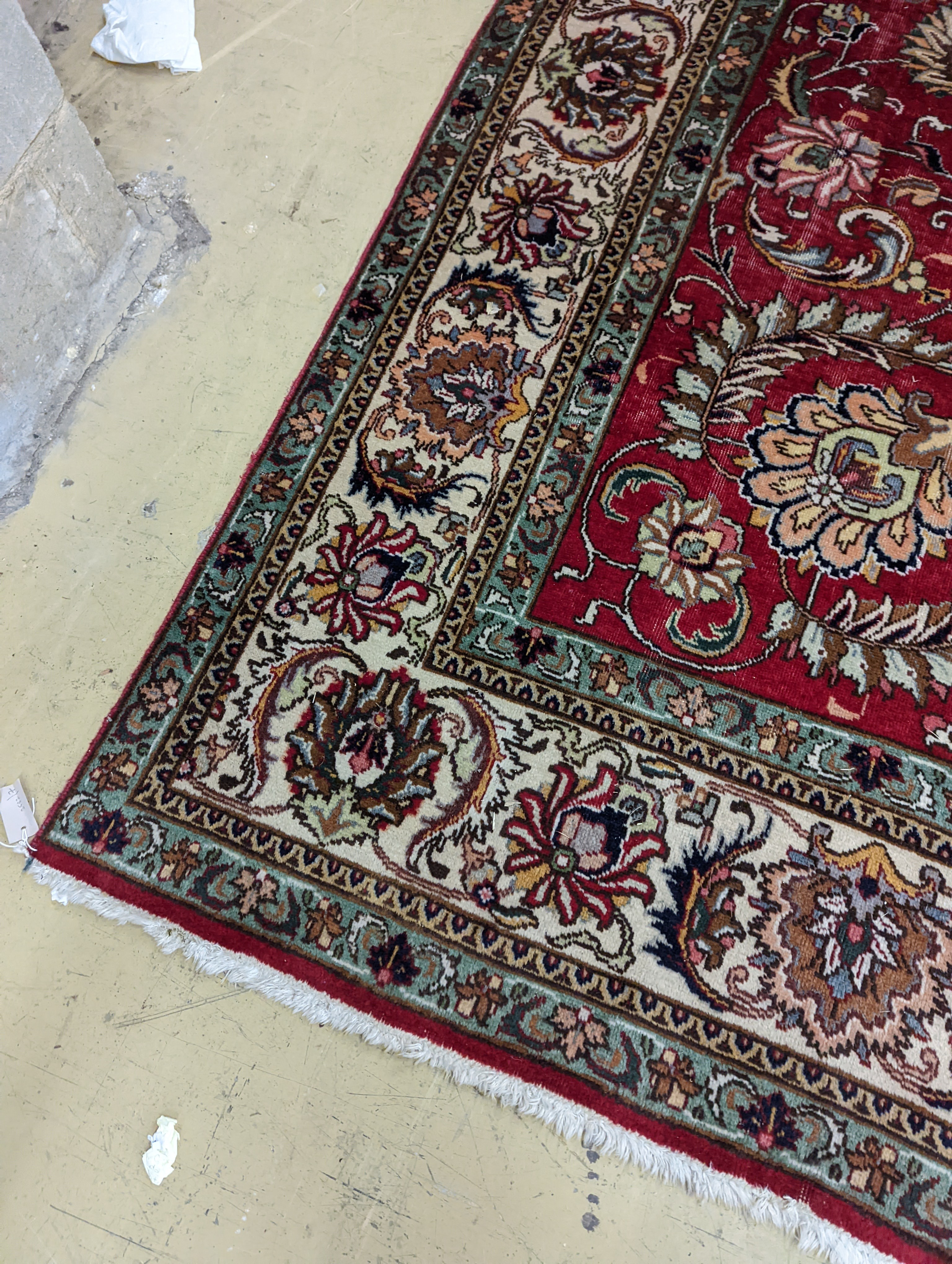 A Tabriz red ground carpet, 400 x 290cm